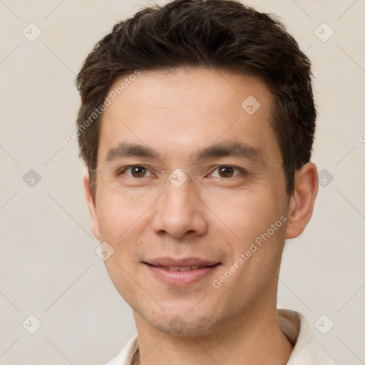 Joyful white young-adult male with short  brown hair and brown eyes