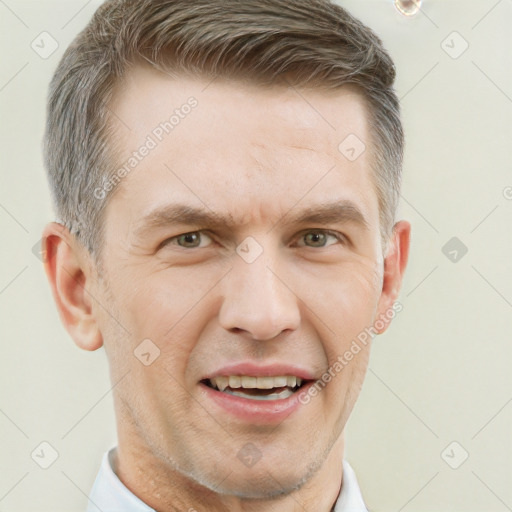 Joyful white adult male with short  brown hair and grey eyes