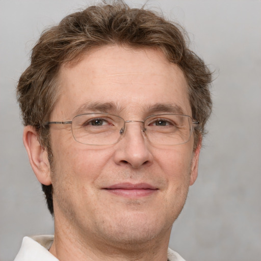 Joyful white middle-aged male with short  brown hair and grey eyes