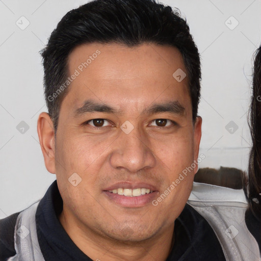 Joyful white adult male with short  brown hair and brown eyes