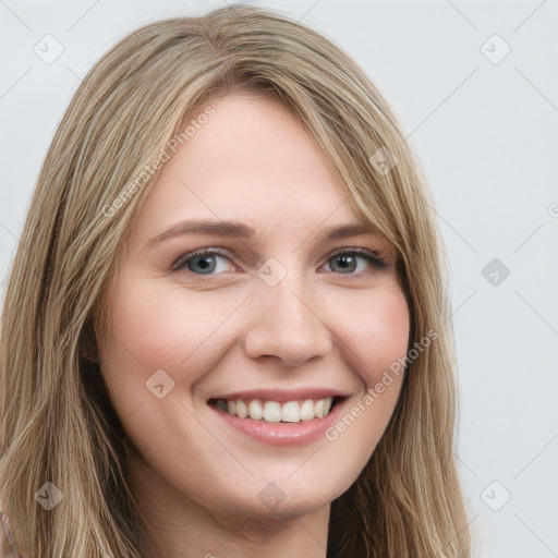 Joyful white young-adult female with long  brown hair and green eyes