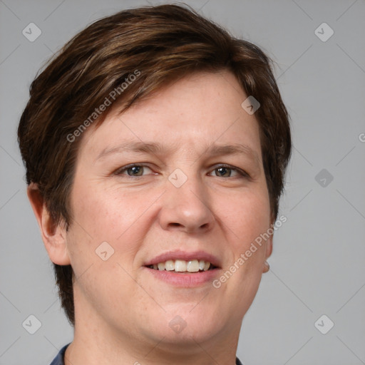 Joyful white adult female with short  brown hair and grey eyes