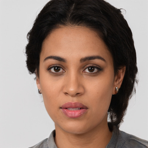 Neutral latino young-adult female with medium  black hair and brown eyes