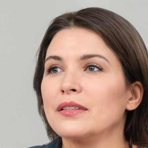 Neutral white young-adult female with medium  brown hair and brown eyes