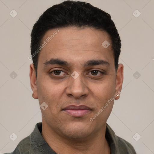 Joyful white young-adult male with short  black hair and brown eyes