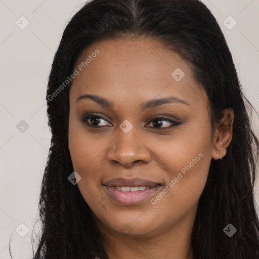 Joyful black young-adult female with long  brown hair and brown eyes