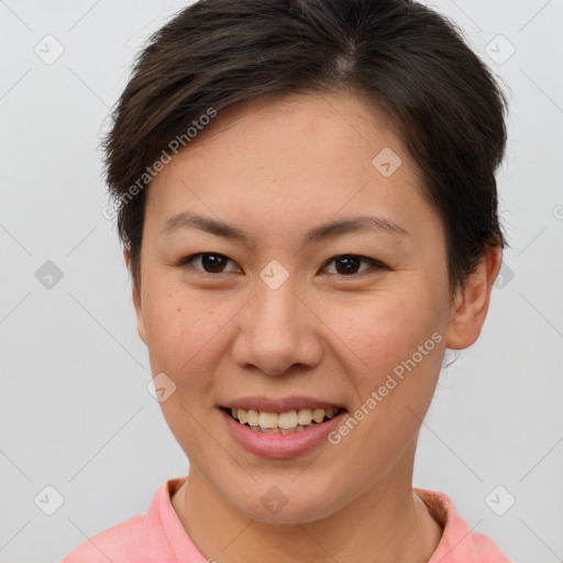 Joyful white young-adult female with short  brown hair and brown eyes