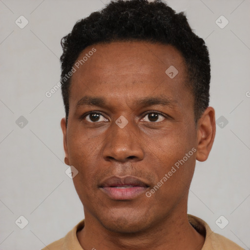 Neutral black adult male with short  black hair and brown eyes