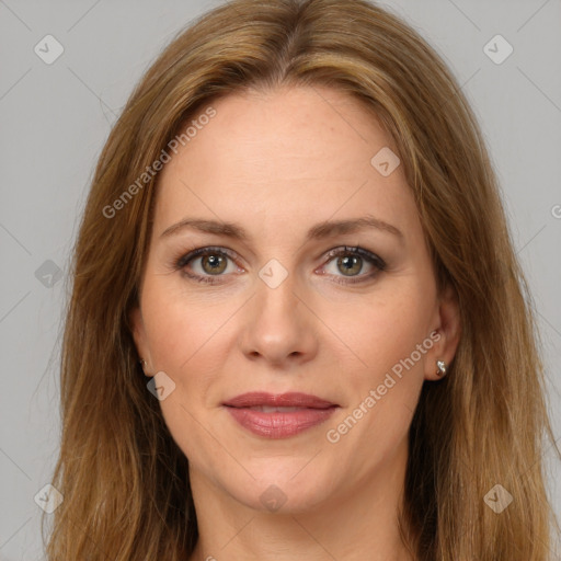 Joyful white adult female with long  brown hair and brown eyes