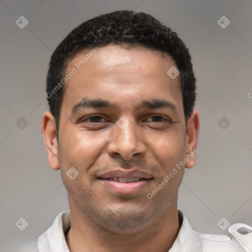 Joyful white young-adult male with short  black hair and brown eyes