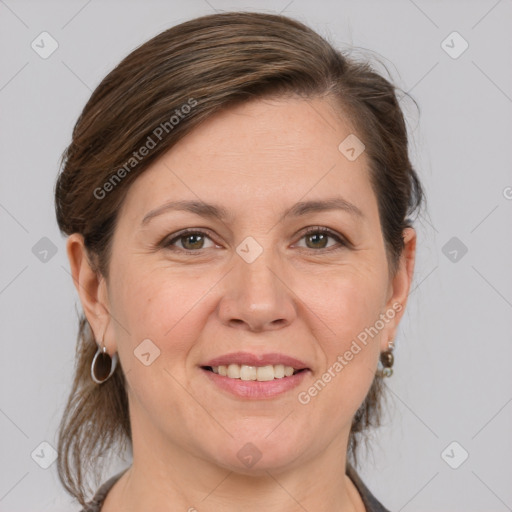 Joyful white adult female with medium  brown hair and grey eyes