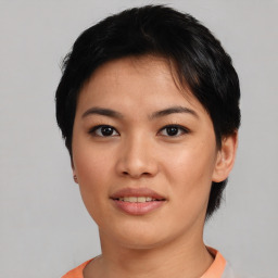 Joyful asian young-adult female with short  black hair and brown eyes