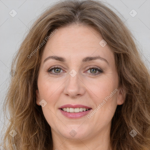 Joyful white adult female with long  brown hair and brown eyes