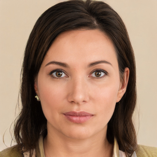 Joyful white young-adult female with medium  brown hair and brown eyes