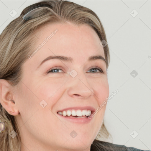 Joyful white young-adult female with long  brown hair and blue eyes