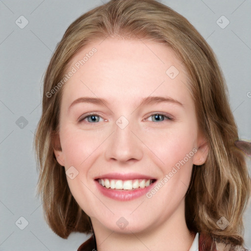 Joyful white young-adult female with medium  brown hair and blue eyes