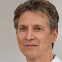 Joyful white middle-aged male with short  brown hair and brown eyes