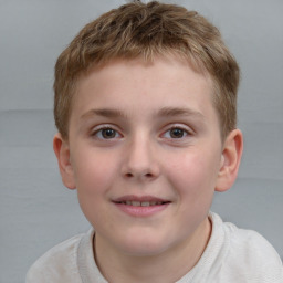 Joyful white child male with short  brown hair and brown eyes