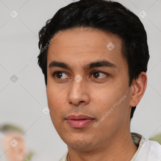 Neutral latino young-adult male with short  black hair and brown eyes