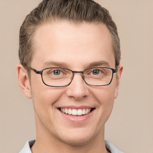 Joyful white adult male with short  brown hair and grey eyes