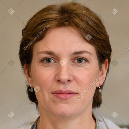 Joyful white adult female with medium  brown hair and grey eyes