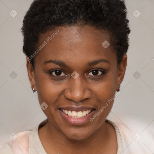 Joyful black young-adult female with short  brown hair and brown eyes