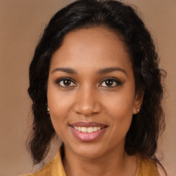 Joyful black young-adult female with medium  brown hair and brown eyes