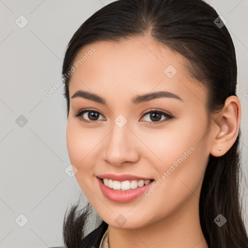 Joyful white young-adult female with long  brown hair and brown eyes