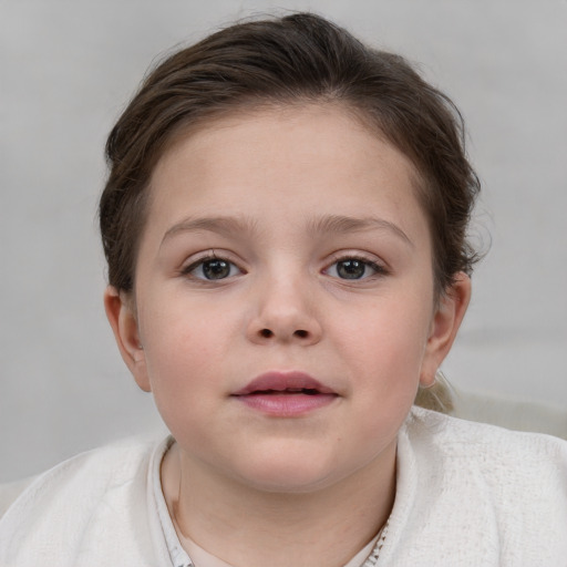 Neutral white child female with short  brown hair and blue eyes