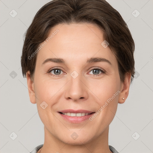 Joyful white young-adult female with short  brown hair and brown eyes