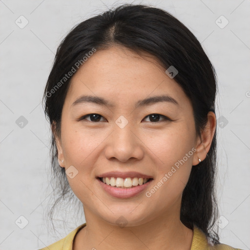 Joyful asian young-adult female with medium  brown hair and brown eyes