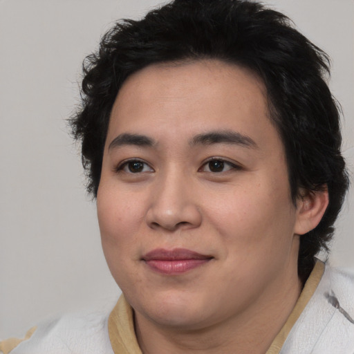 Joyful asian young-adult female with medium  black hair and brown eyes