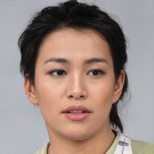 Neutral asian young-adult female with short  brown hair and brown eyes