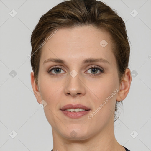 Joyful white young-adult female with short  brown hair and grey eyes