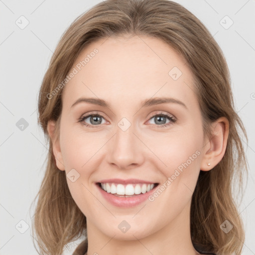 Joyful white young-adult female with medium  brown hair and blue eyes