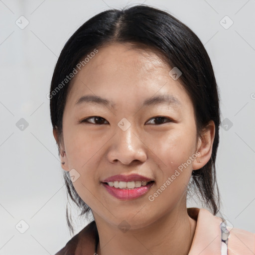 Joyful asian young-adult female with medium  black hair and brown eyes