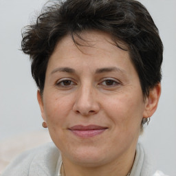 Joyful white adult female with short  brown hair and brown eyes