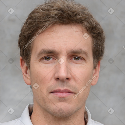 Joyful white adult male with short  brown hair and grey eyes