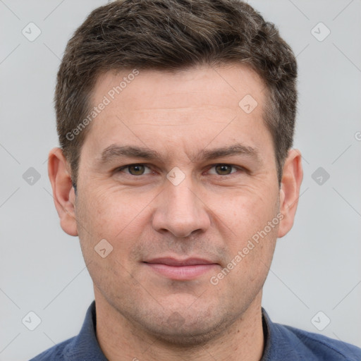 Joyful white adult male with short  brown hair and grey eyes