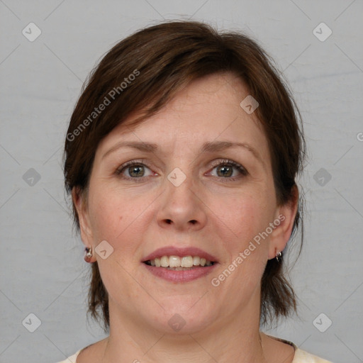 Joyful white adult female with medium  brown hair and grey eyes