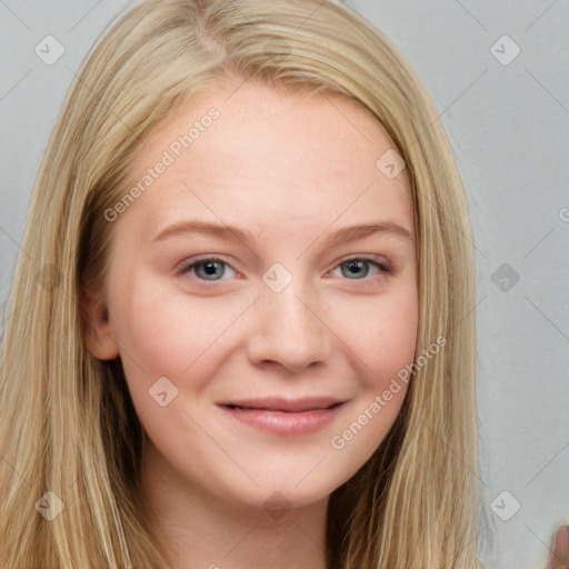 Joyful white young-adult female with long  brown hair and blue eyes