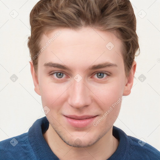 Joyful white young-adult male with short  brown hair and blue eyes