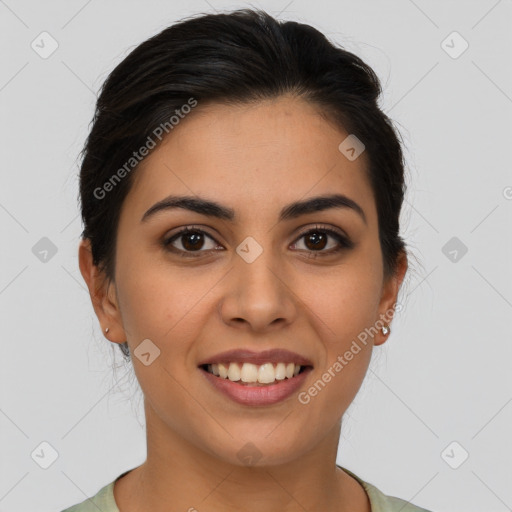 Joyful latino young-adult female with long  brown hair and brown eyes