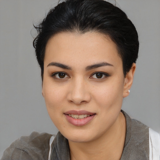 Joyful asian young-adult female with short  brown hair and brown eyes