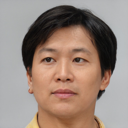 Neutral asian adult male with short  brown hair and brown eyes