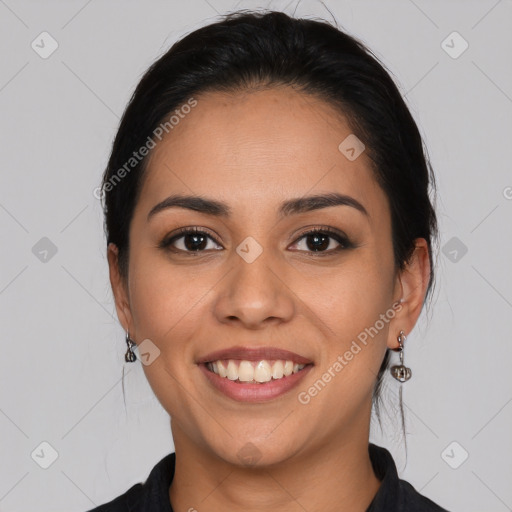 Joyful latino young-adult female with long  black hair and brown eyes