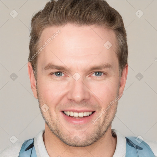 Joyful white adult male with short  brown hair and grey eyes