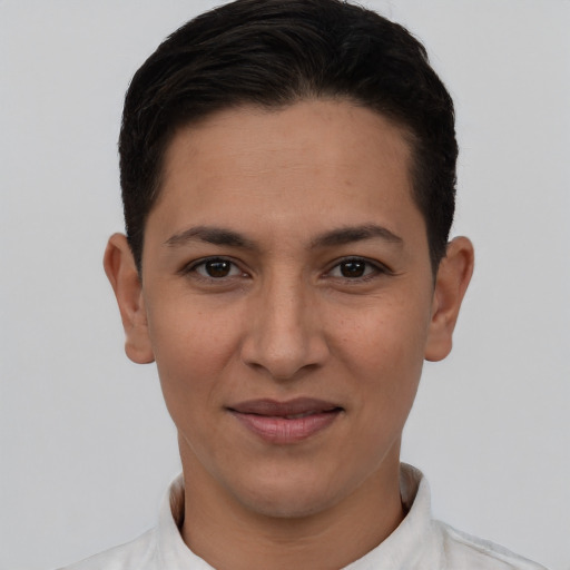 Joyful latino young-adult female with short  brown hair and brown eyes