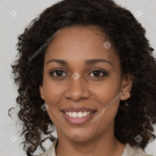 Joyful black young-adult female with medium  brown hair and brown eyes