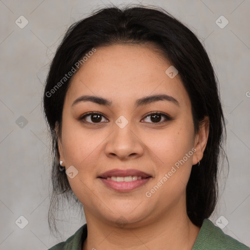 Joyful latino young-adult female with medium  brown hair and brown eyes